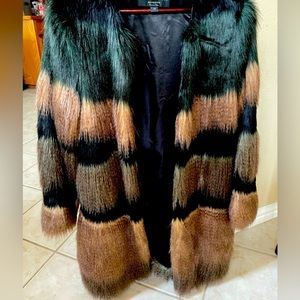 Faux fur color blocked knee length coat